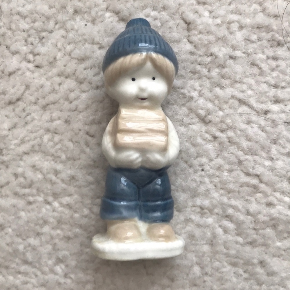 Boy Holding Logs Antique Figurine